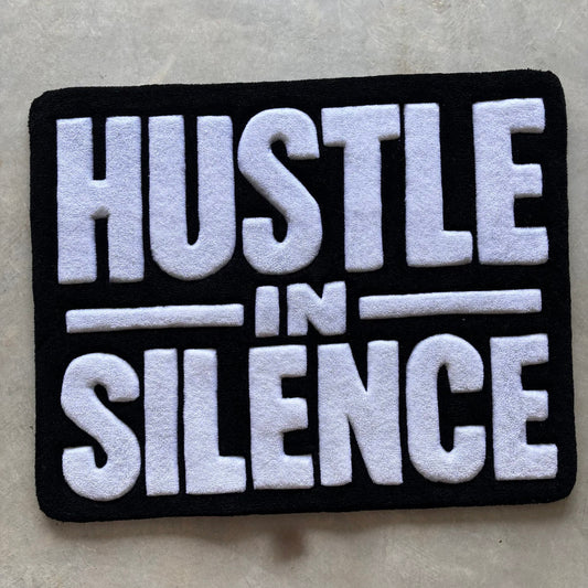 "HUSTLE IN SILENCE" RUG