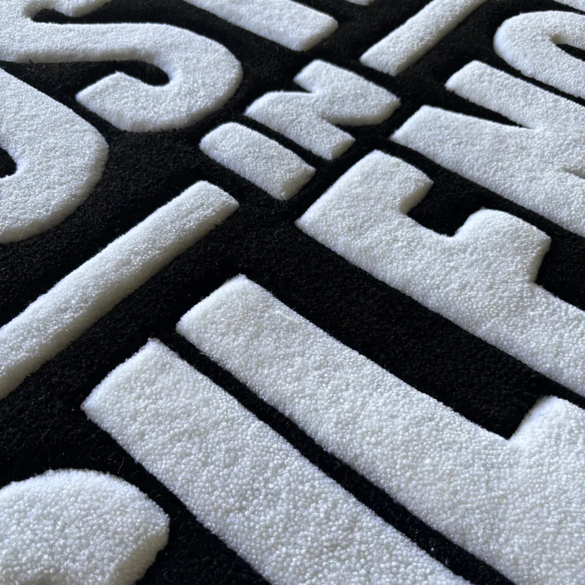 "HUSTLE IN SILENCE" RUG